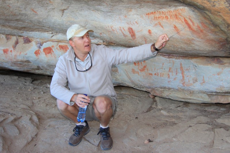 Seppie our knowledgeable guide explaining rock art